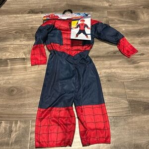Spider Man child s costume. New in its original packaging. Size Toddler 2-3 yo